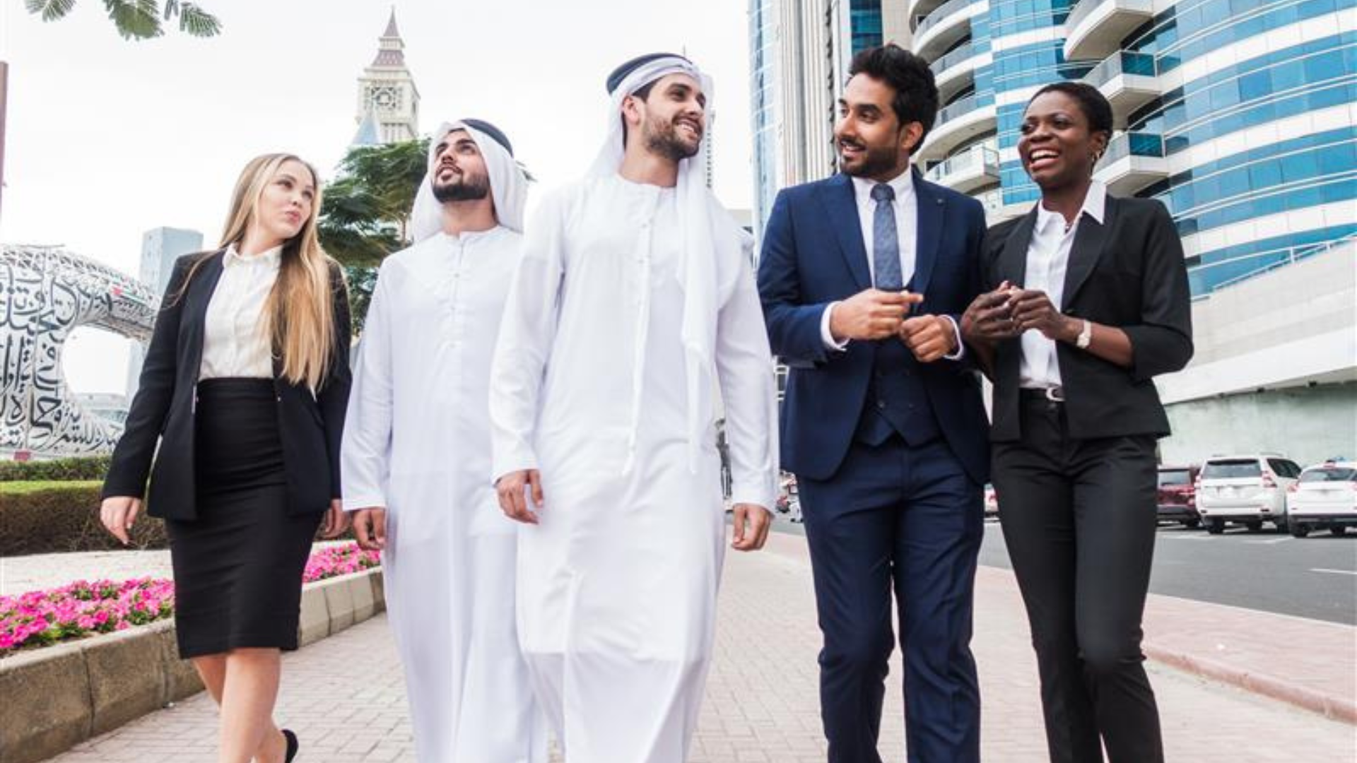 UAE business professionals shaking hands in office after staffing partnership